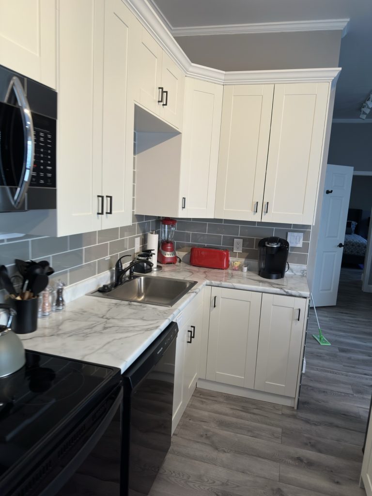 Spotless white kitchen after a deep clean