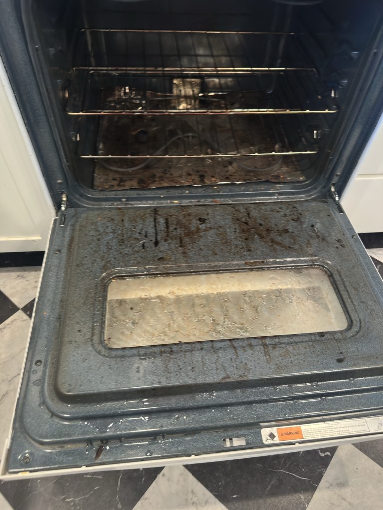Dirty oven interior before deep cleaning