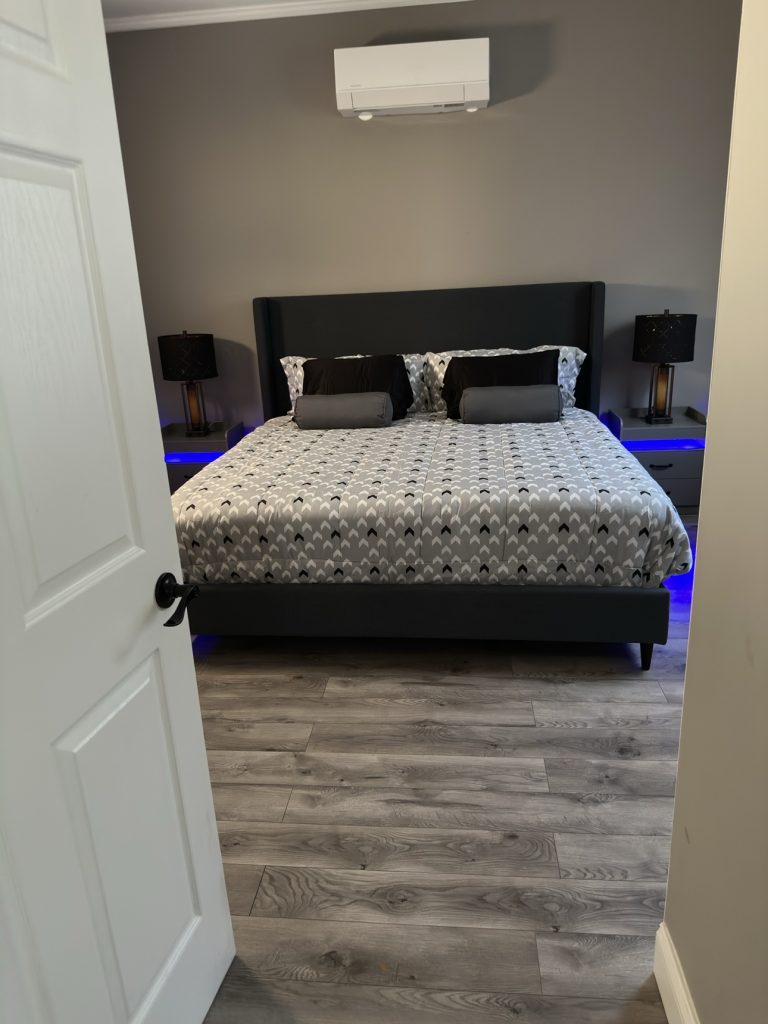 Freshly cleaned bedroom with made bed