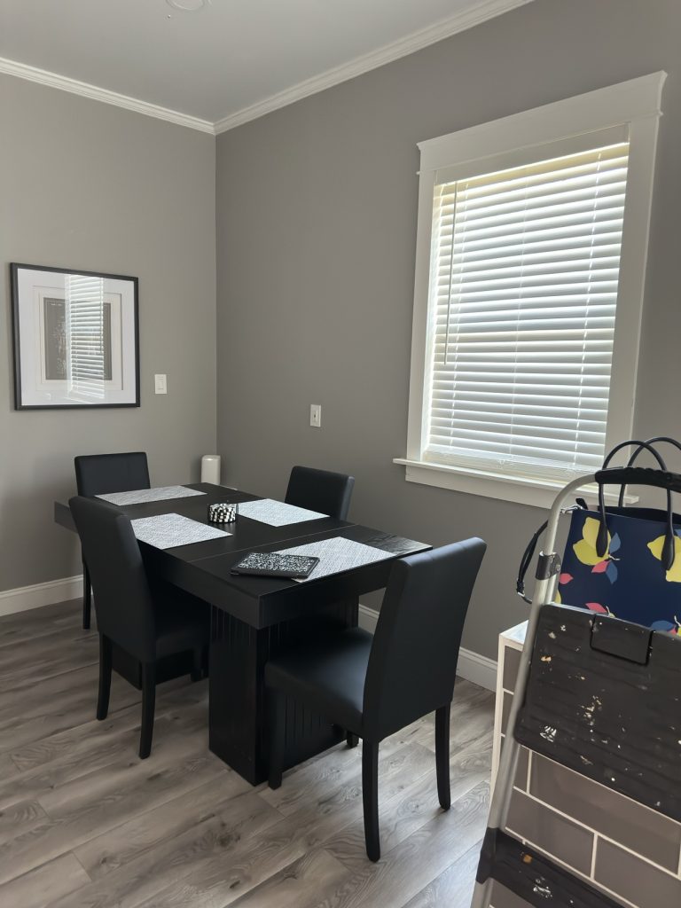 Tidy dining area with table and chairs