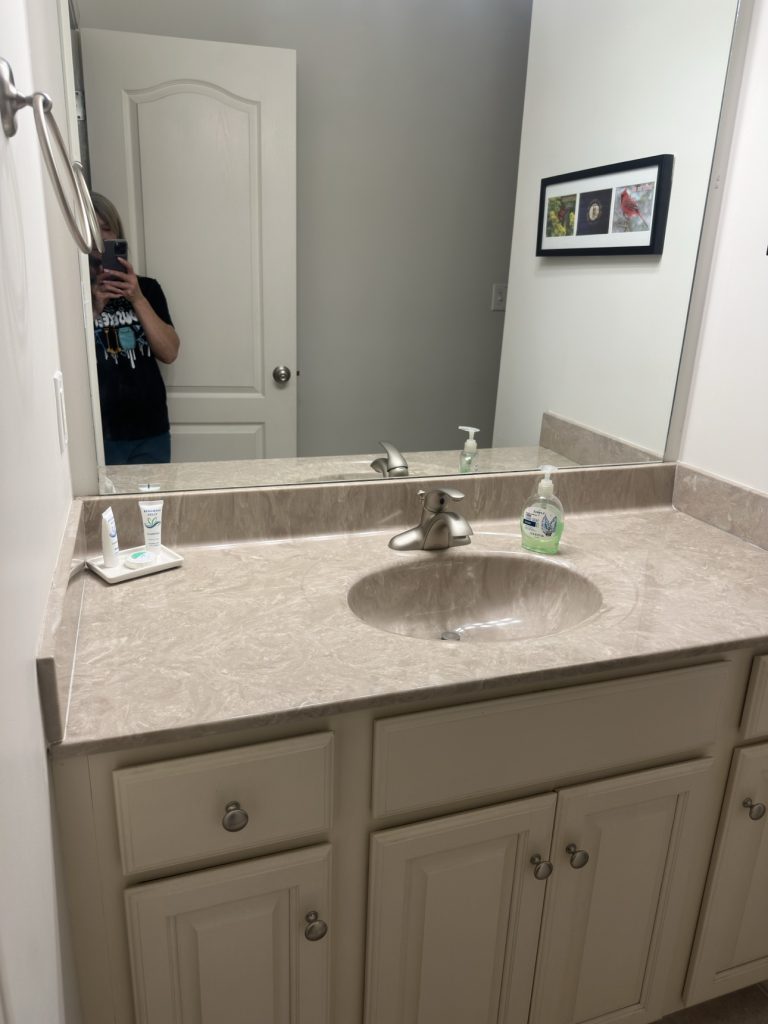 Spotless bathroom vanity with sink and mirror